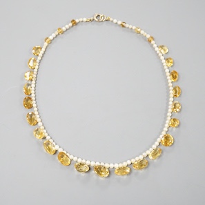 A single strand oval cut citrine and seed pearl set fringe necklace, with 9ct clasp, 44cm